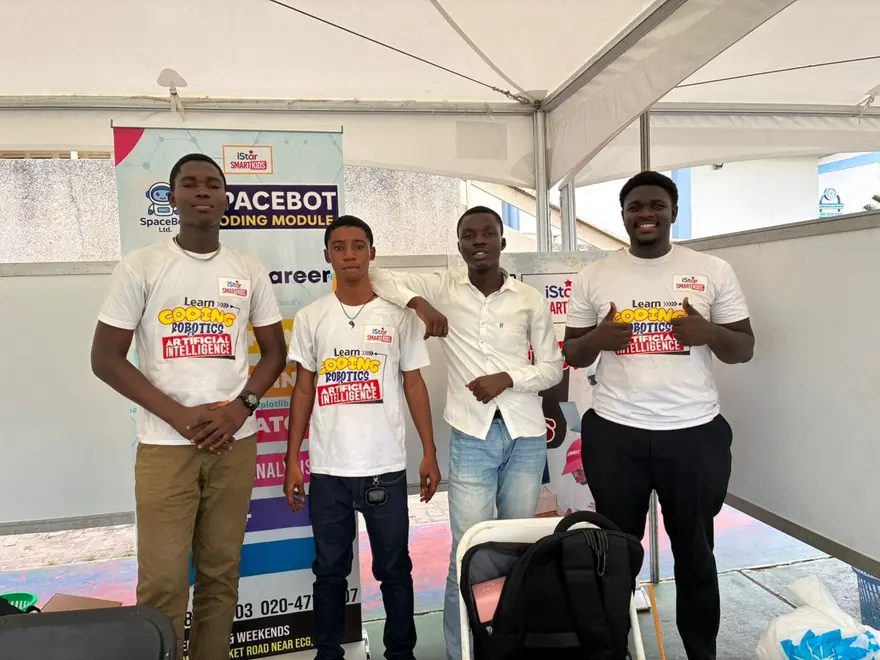 The iSTAR Smart Kids team at an exhibition booth in iSTAR T-shirts